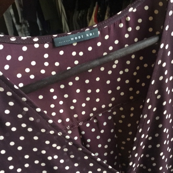 allan surplice rolltab high low blouse